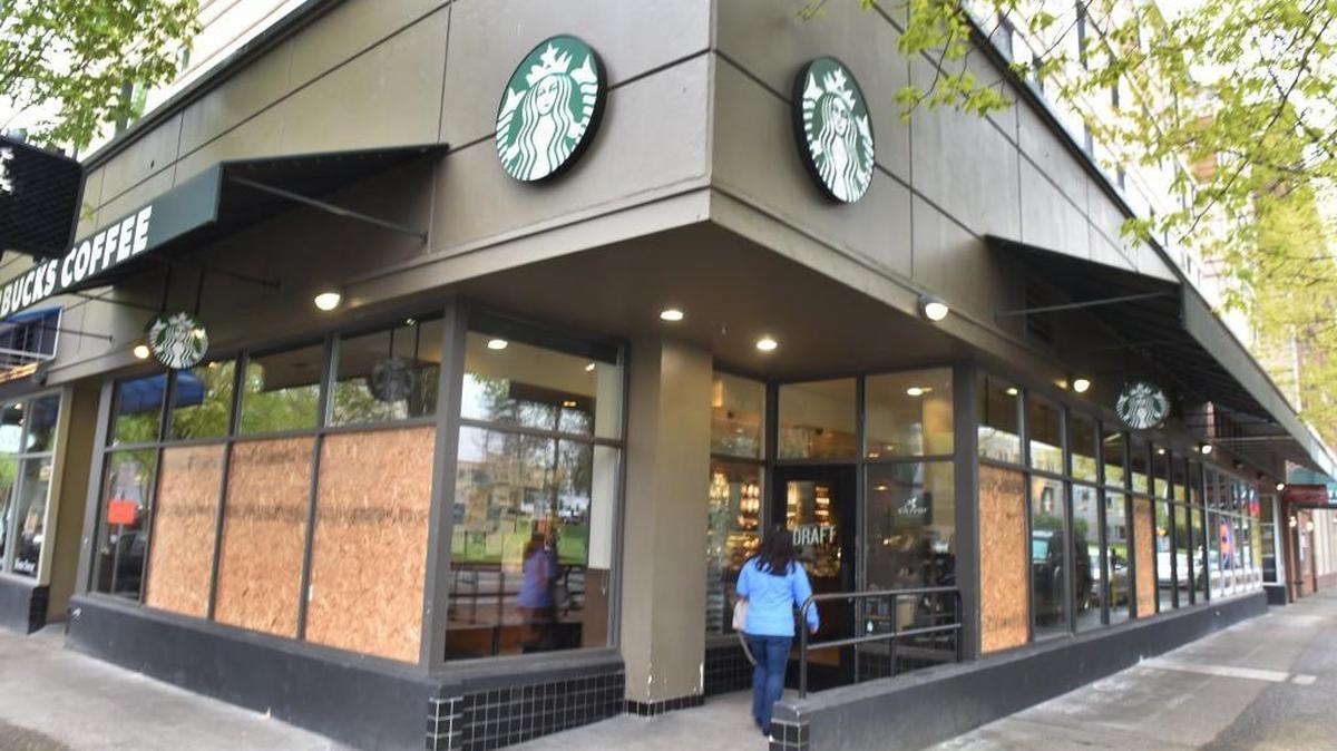 Starbucks and Olympia Federal Savings were among the businesses that had to clean up early Tuesday after May Day violence Monday.