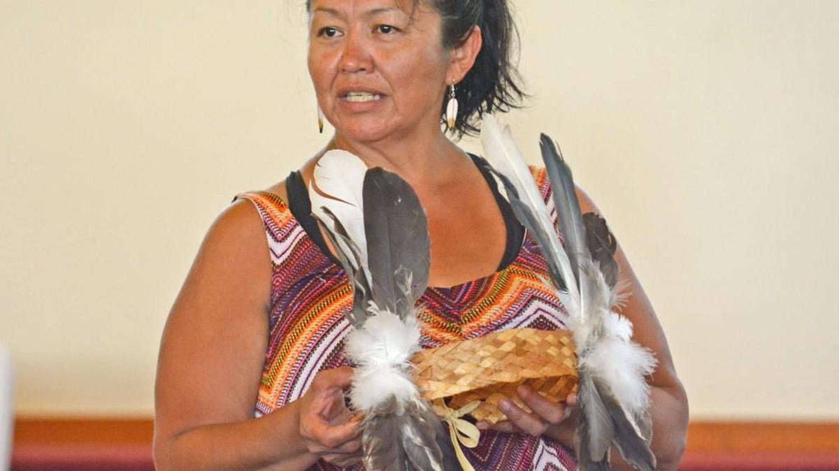 Aurelia Washington, tribal cultural committee advisor, holds a cedar headdress as she speaks to educators from La Conner and Concrete school districts and Western Washington University about the new Since Time Immemorial curriculum.