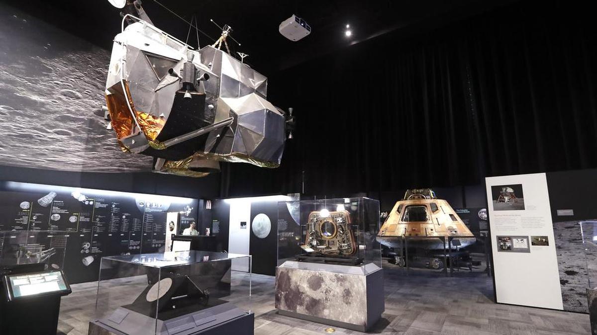 The NASA Apollo 11 command module Columbia, right, sits as the centerpiece of Destination Moon: The Apollo 11 Mission exhibit at the Museum of Flight in Seattle. The exhibit, opening April 13, celebrates the 50th anniversary of the U.S. manned moon landing on July 20, 1969. The exhibit includes artifacts from the Apollo 11 mission, including Buzz Aldrin's outer visor and gloves worn while walking on the moon, a star chart, medical kit and survival kit (for an emergency landing on Earth). The display also includes a full-scale replica of the lunar module ascent vehicle, upper left, and salvaged F-1 engine parts, which powered the Saturn V rocket that took the Apollo modules to space and were recovered from the Atlantic ocean more than 40 years later.