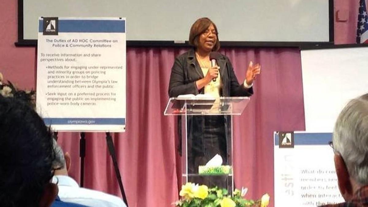 Karen Johnson of the Black Alliance of Thurston County speaks Oct. 10 at a forum of the Ad Hoc Committee on Police and Community Relations at the Risen Faith Fellowship Church in Olympia.