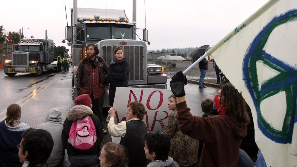 Protesters block a military shipment from exiting the Port of Olympia Friday Nov. 9, 2007. No further convoys were planned for the evening because police didn't have the resources at the port entrance to deal with protesters.