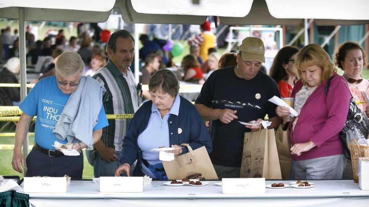 Mushroom fans line up for food samples during the fifth-annual Pacific Northwest Mushroom Festival at the Regional Athletic Complex in Lacey.