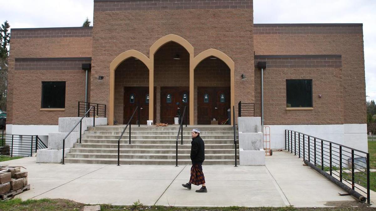 A man walks past the still-vacant mosque on his way to Friday prayer at the Masjid al-Nur Islamic Center of Olympia. Feb. 6, join a discussion called American Muslims: History, Culture and Politics, 4-6 p.m., Lacey Timberland Regional Library, 500 College St. SE. 360-491-3860, trl.org.