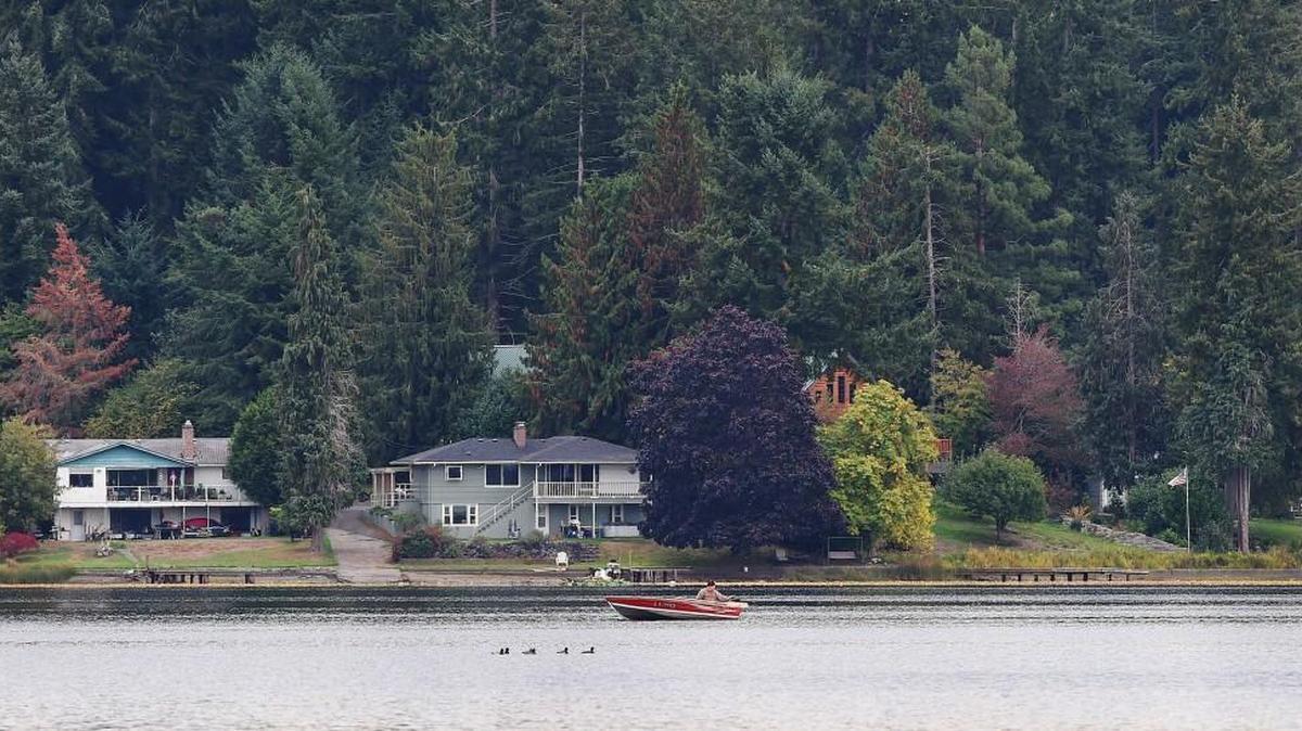 
A lone boater enjoys a serene Tuesday morning on Hicks Lake as the Lacey City Council got ready to approve a management district for the lake.
