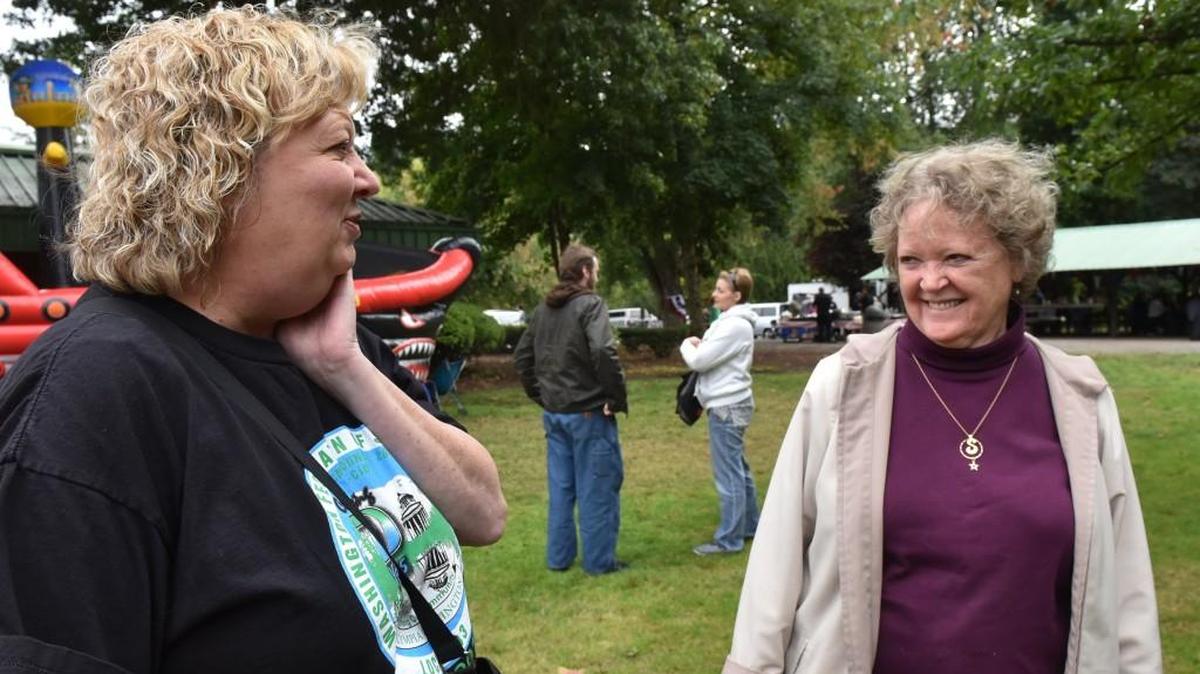Attending the annual Labor Day Picnic with her sister Sandy Newgard, right, Labor and Industries employee Jean Edwards enjoys meeting her co-worker's families at the Sept. 5 event at Tumwater Historical Park.
