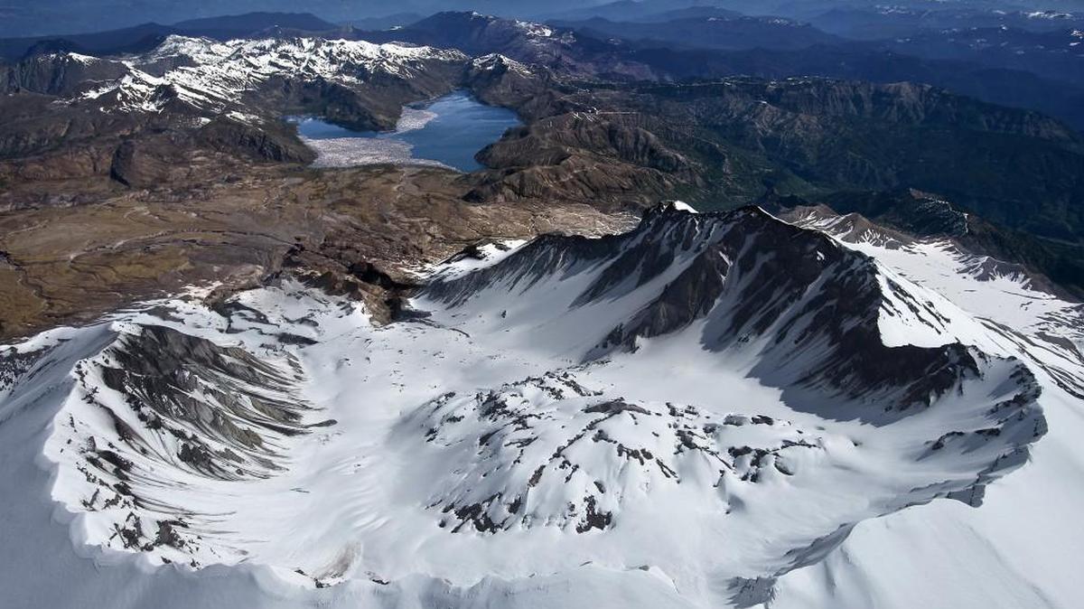 Staff file: The panoramic and breathtaking view of the south rim of Mount St. Helens, looking past a still venting lava dome north toward Spirit Lake and Mount Rainier, is awe inspiring, as seen in 2014. More than a dozen small earthquakes rattled the area on Wednesday morning.
