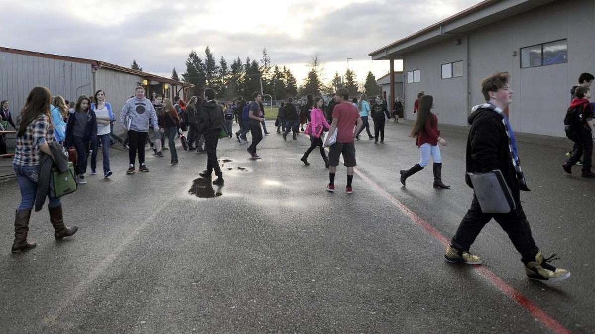 Students at Yelm Middle School move between portable classrooms in 2016.