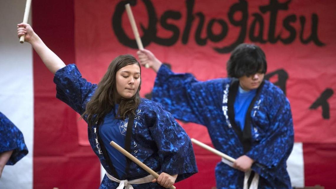 Mikenzi Ikerd, 15, and Damien Zucker, 14, perform with the River Ridge High School Taiko Drummers during the Olympia-Kato Sister City Association’s annual Oshogatsu festival in The Olympia Center on Saturday.