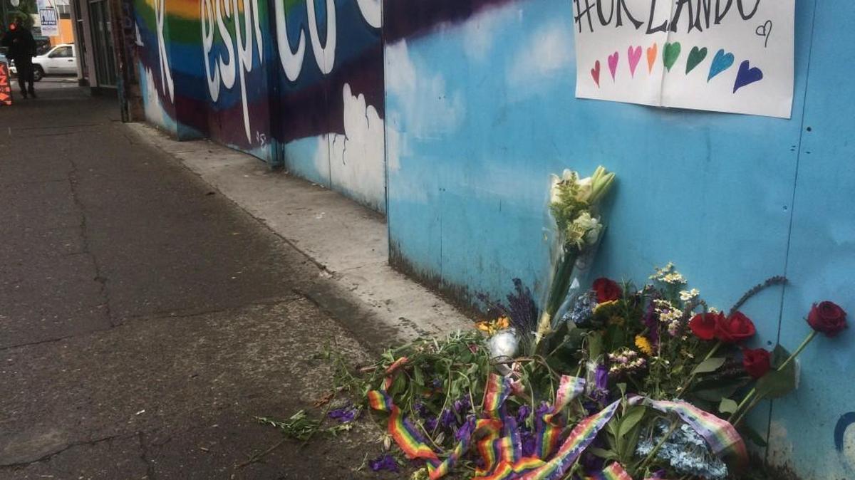 A small impromptu memorial to the victims of the Orlando mass shooting, as seen Monday afternoon in front of the Respect and Love Olympia mural on Fourth Avenue in downtown Olympia.
