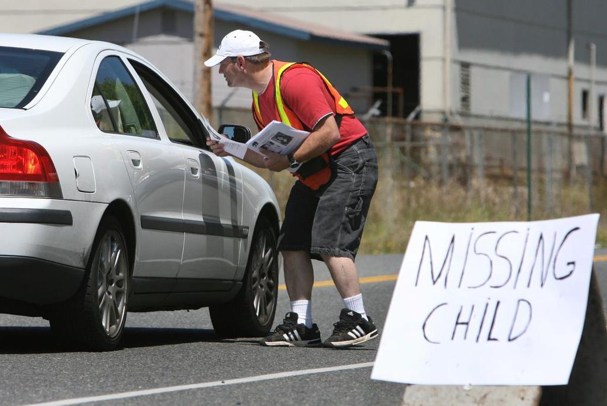 Neil Newell took took the day off work to hand out photo flyers of missing 10-year-old Lindsey Baum at a downtown McCleary check-point just days after her disappearance. Newell's daughter was a classmate of Baum’s.