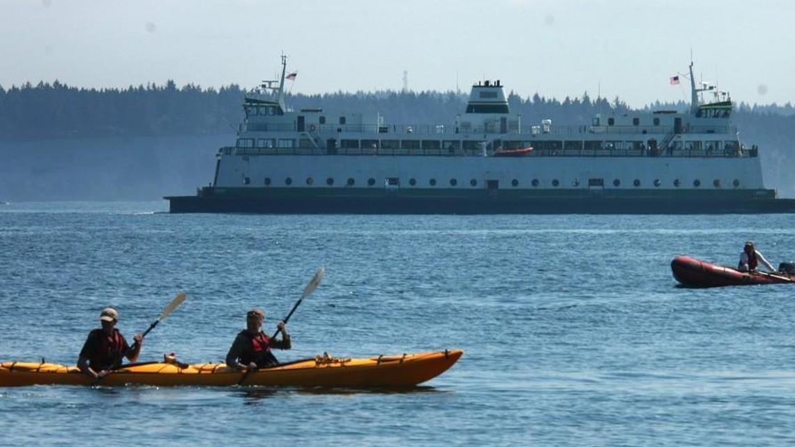 Staff file: A state ferry bound passes boaters near Port Townsend’s downtown docks in 2006. An Olympia lawmaker has proposed the study of passenger-only ferry service between Olympia and Seattle.