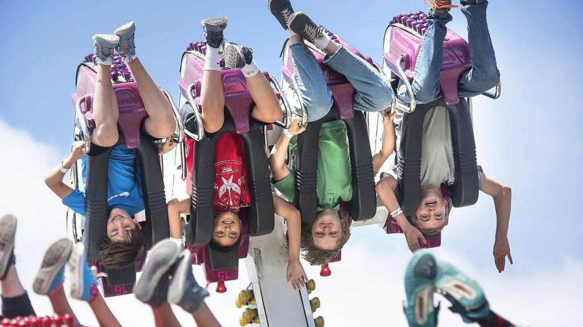 Riders go upside down on the El Nino thrill ride during Funtastic Carnival's unlimited-ride Wristband Day at the Capital Lakefair in Olympia in 2015. Lakefair officials have eliminated Wristband Day -- now, fair-goers can get a wristband any day of the 5-day festival. Discounts on the wristbands are available online until 11:59 p.m. Tuesday, July 11.