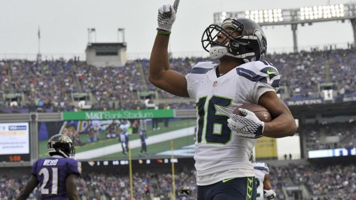 Seattle Seahawks wide receiver Tyler Lockett celebrates a touchdown. Lockett will speak in October in Olympia.