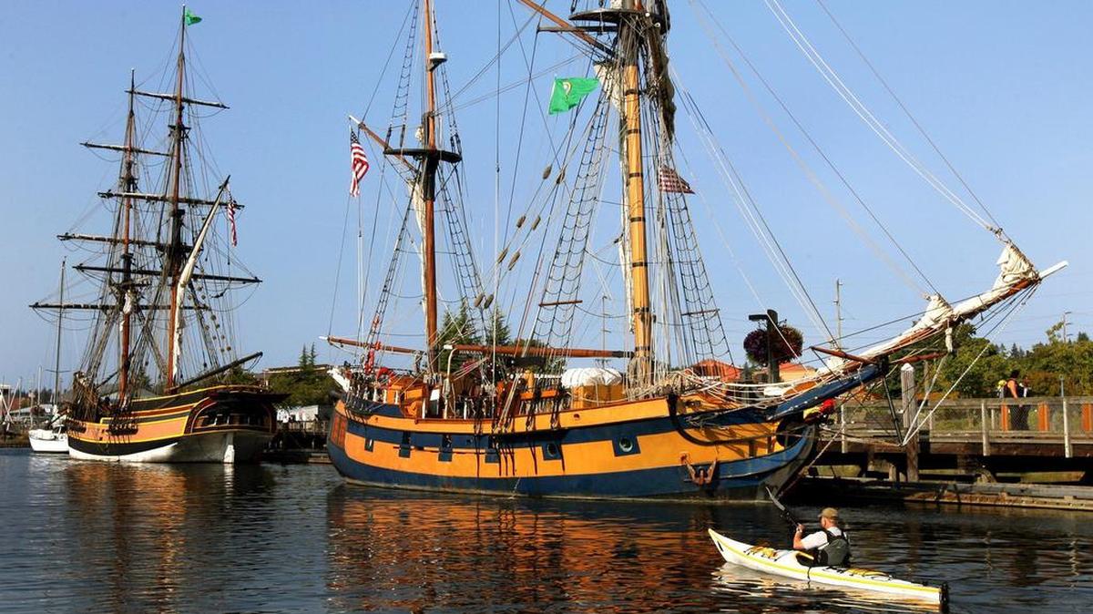 Kayaker John Birbeck passes alongside the tall ship Hawaiian Chieftain at Percival Landing in Olympia. Both Hawaiian Chieftain and her sister ship Lady Washington have been regular participants in the annual Olympia Harbor Days festival on Labor Day weekend.