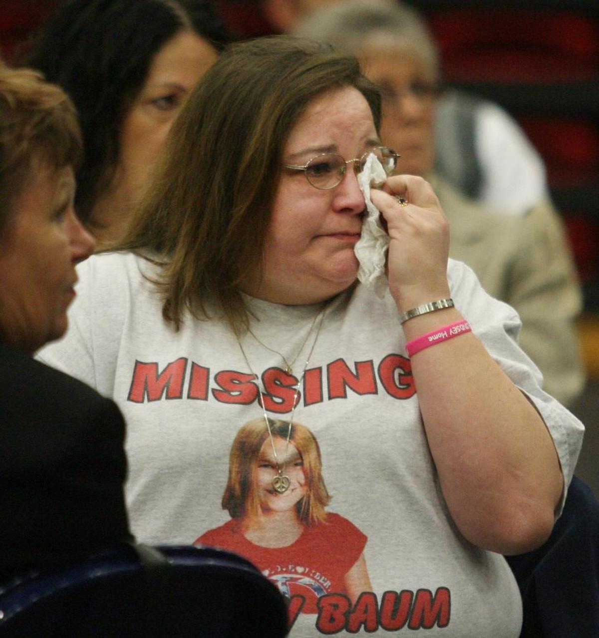 Melissa Baum, Lindsey’s mother, wipes a tear from her eye as she listens to abduction survivor Elizabeth Smart address a joint meeting of the Rotary Clubs of Thurston County at Saint Martin's University in Lacey.