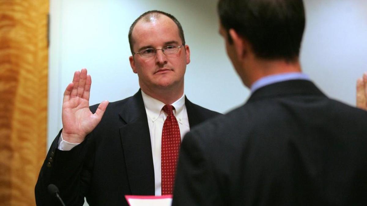 New Lacey city manager Scott Spence is sworn into office Aug. 9, 2011.