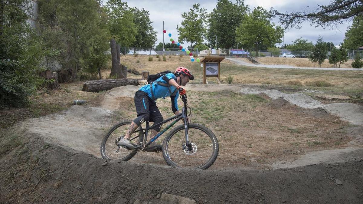 
Jason Gainey of Olympia takes laps on the the new bicycle pump track during the opening ceremonies at Yauger Park in west Olympia last Saturday.
