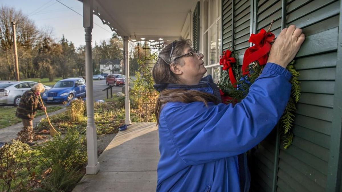 Beverly York puts up handmade swags with ribbons at the Crosby House Museum Friday Dec. 12, 2015 in Tumwater. York and other members of the Olympia Chapter No. 4 of the Daughters of the Pioneers of Washington decorated the museum for the annual Holiday Tour of Historic Homes in Olympia and Tumwater, featuring five historic properties on the southeast side Olympia.