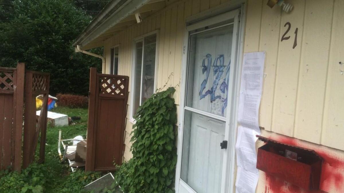 The abandoned duplex at 211 and 221 Blass Ave. SE in Tumwater is owned by mortgage company Fannie Mae, but a dispute in ownership has surfaced because the property’s tax parcel number corresponds with an identical duplex next door.