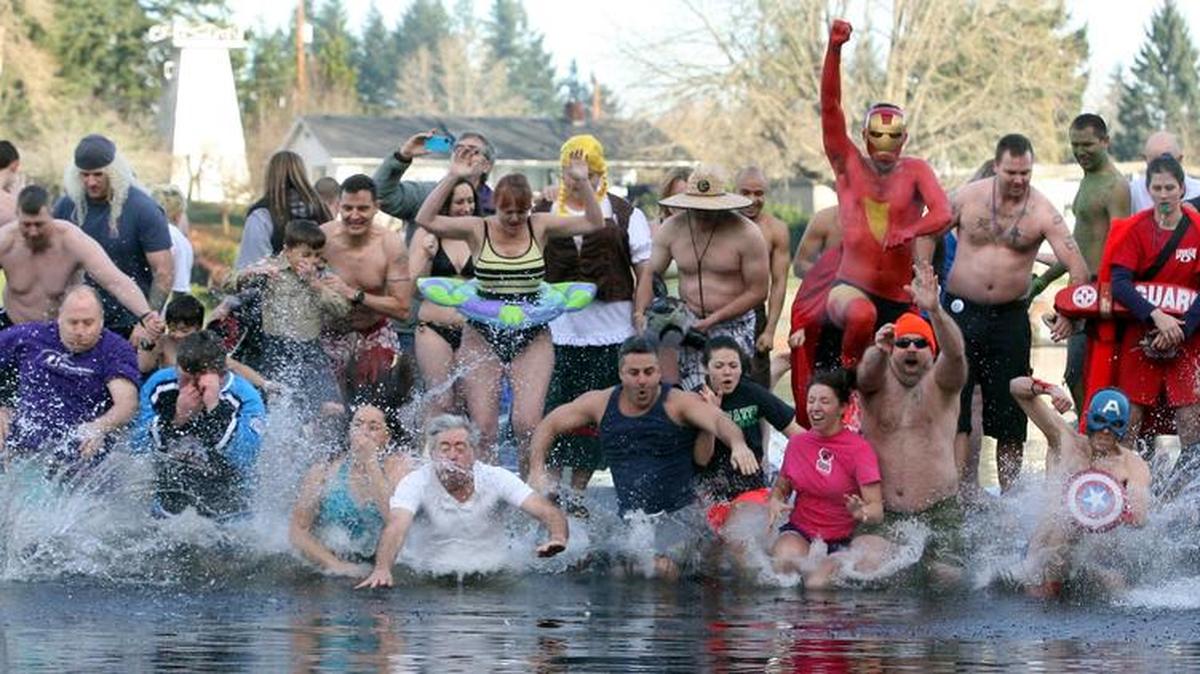 An estimated 600 hearty souls braved the 42-degree waters of Long Lake to take part in the 2013 Polar Bear Plunge.