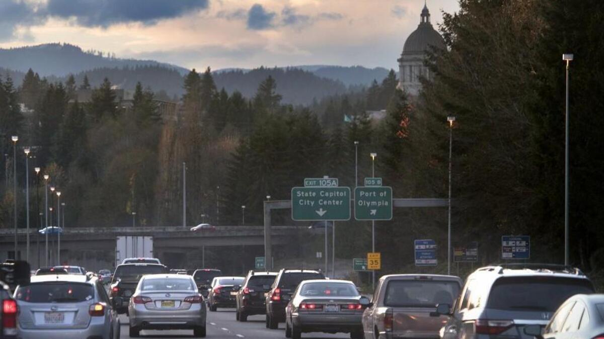Southbound traffic on Interstate 5 slows at the beginning of the evening rush hour in OIympia on Nov. 17. The state will soon test ways of charging drivers for miles traveled instead of gallons of gasoline burned.