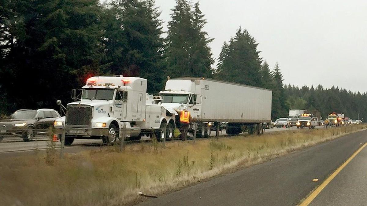 A semi-truck is prepared to be towed from the site of an Aug. 1st collision on Interstate 5 Northbound around 6:30 a.m which temporarily blocked several lanes lane near Martin Way and milepost 109.