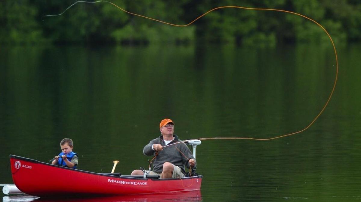 Staff file: Robert Brown of Olympia casts his line over Offutt Lake during a trout fishing trip with his grandson, Cody Vezina, 4, in 2005. An algae bloom has been reported at the lake, according to Thurston County Public Health and Social Services.