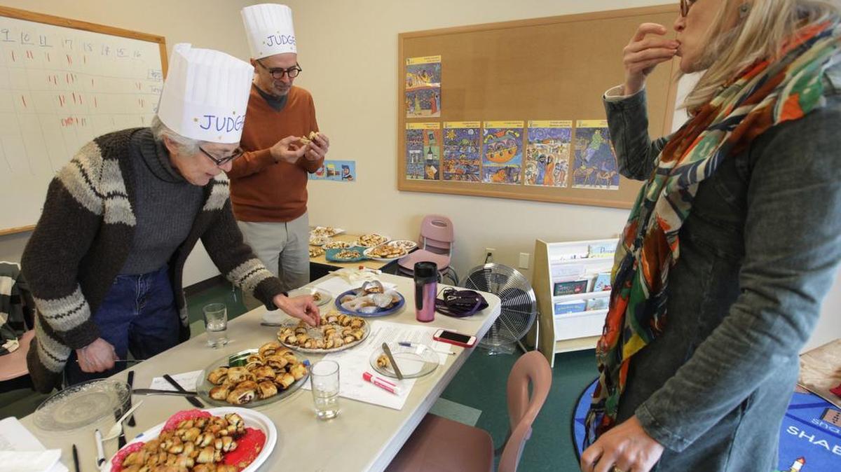 From left, rugelach pastry judges Bev Postman, George Le Masurier and Cheryl Selby hit the home stretch in the voting for the tastiest entries at the Blintzapalooza 2014 fundraiser.