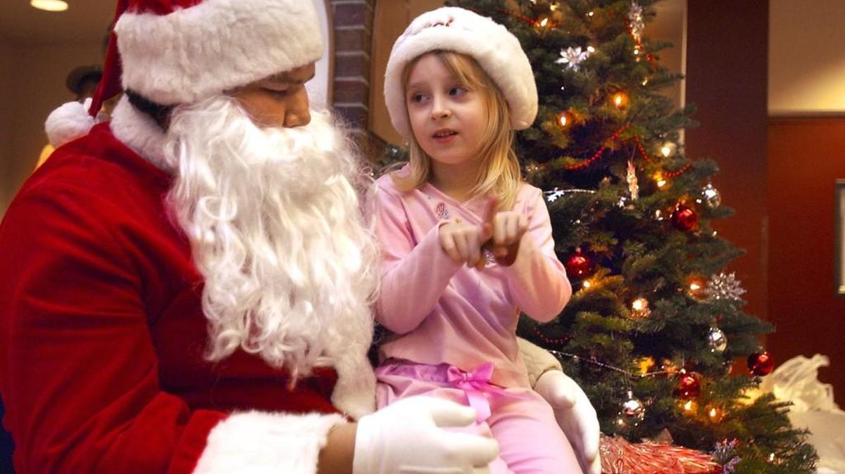 Star Waterer, 5, signs to Santa that she wants a Barbie for Christmas during a previous "Signing Santa" event at Saint Martin's University. Lacey Parks & Recreation and the Signing Santa Organization are partnering this year to provide deaf and hard-of-hearing children a chance celebration the holidays from 6:30-9 p.m. Friday at Chambers Prairie Elementary in Lacey.