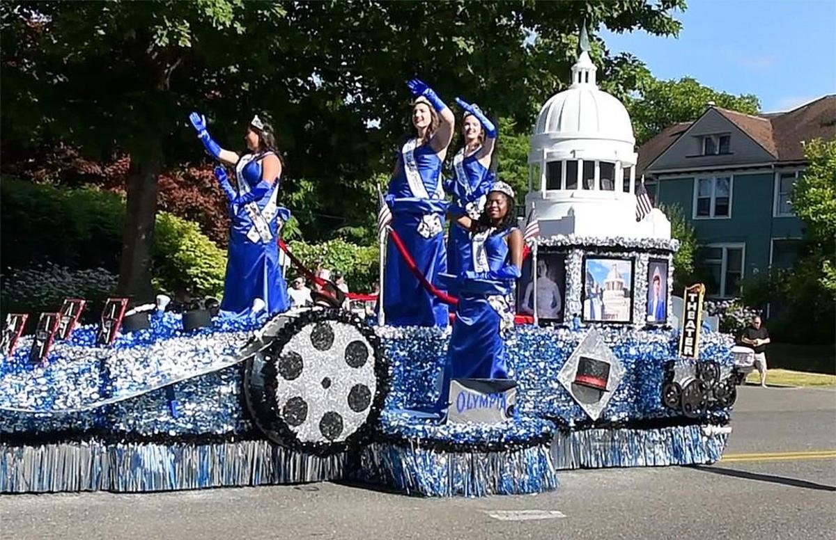 With royalty on board, the Capital Lakefair float moves down Capitol Way in 2017 to start the 60th annual Capital Lakefair Grand Parade.