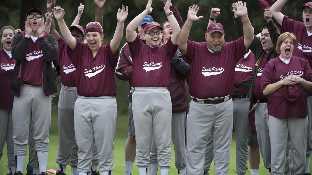 The Kitsap County SK Wolves let out a cheer during the opening ceremonies of the Southwest Region Special Olympics Softball Tournament at LBA Park in Olympia on Saturday, July 23, 2016.