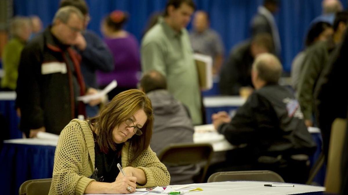 Carol Goodwin of Shelton fills out an application in November 2012 at the seventh-annual Veteran Stand Down and Hiring event at the Olympia National Guard Armor. Another hiring event, organized by WorkSource Thurston County, is set for noon-3:30 p.m. Friday (Nov. 20) at the Olympia National Guard Armory, 515 Eastside St. SE.