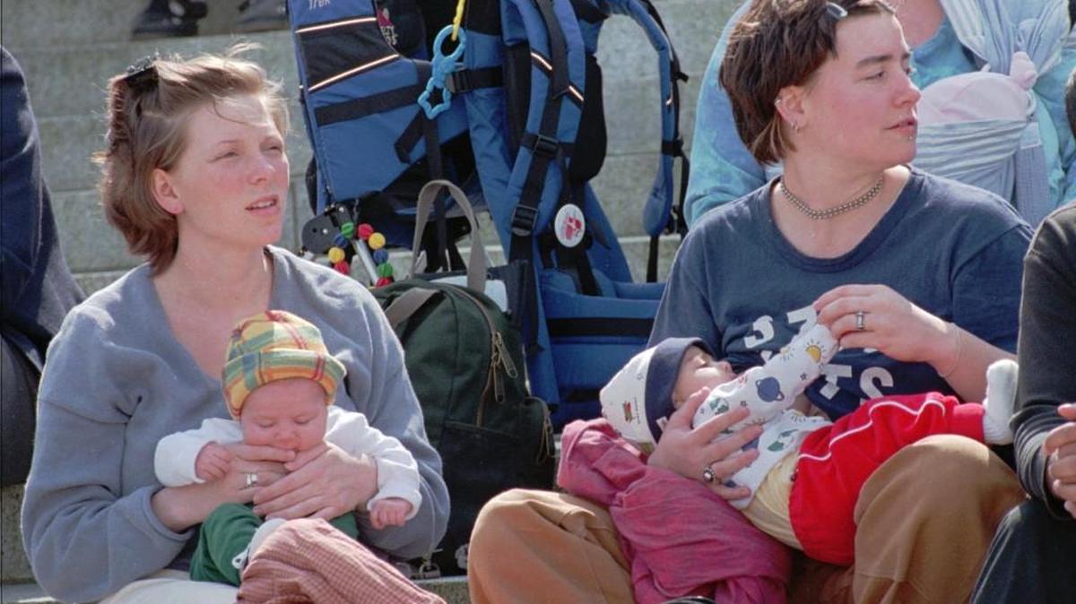 Jennifer Hembree and her daughter Abigail Ball-Hembree, left, and Valerie Taylor and her daughter Kaliah Frances Anjaria-Taylor, listen to speakers Tuesday, April 6, 1999, at a Breast Feeding Awareness Day rally in Olympia, Wash. About 50 people showed their support for legislation that would outlaw discrimination against women who breast feed at work.(AP Photo/Louie Balukoff)