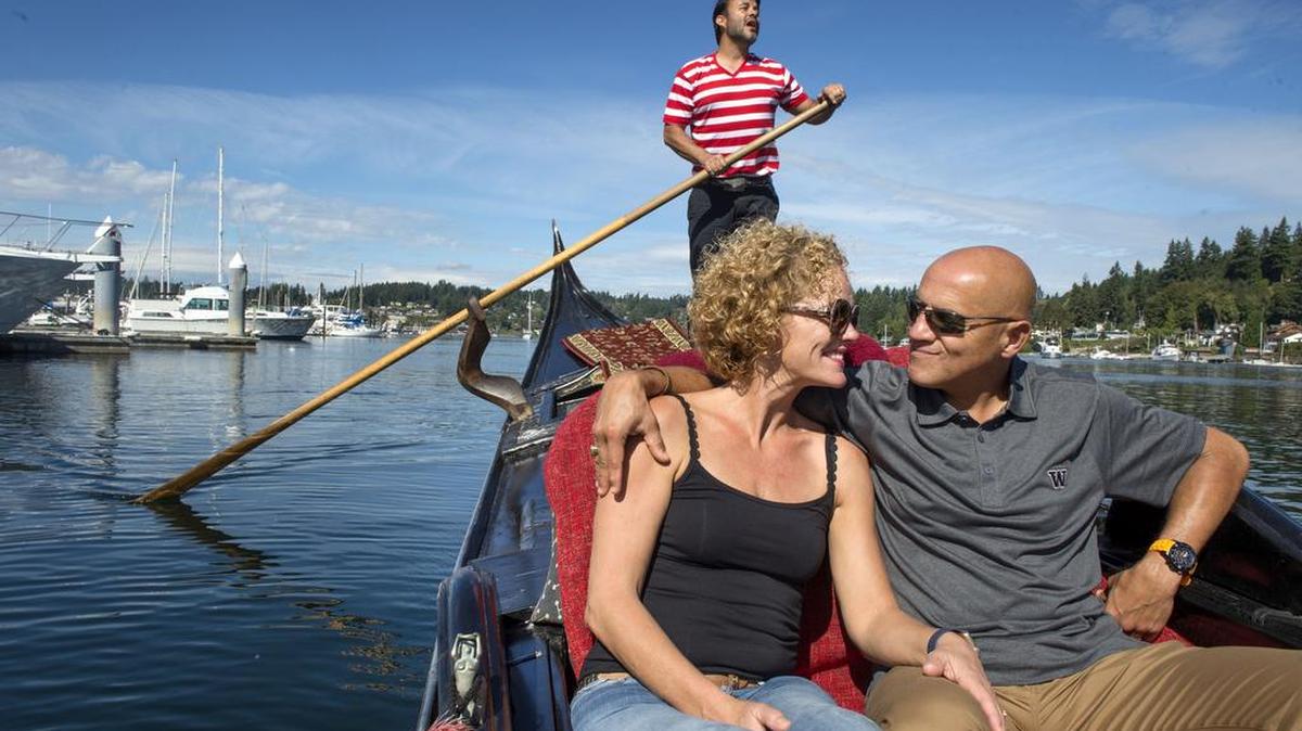 
As John Synco sings the classic Italian love song “Santa Lucia,” Annejo and Julio Roberto Vega Sanchez enjoy a moment on their first-ever gondola ride in Gig Harbor on Thursday. “It feels like I’m in Venice,” said Annejo, who lives in the Netherlands with her husband. Synco recently started his business, Gig Harbor Gondola, after learning to become a gondolier in California.

