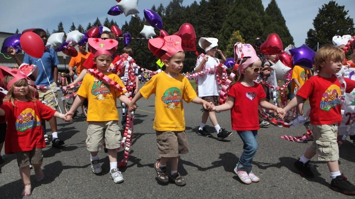Kids from South Sound Church in Lacey march in the Lacey Fun Fair parade at Saint Martin’s University in 2010.