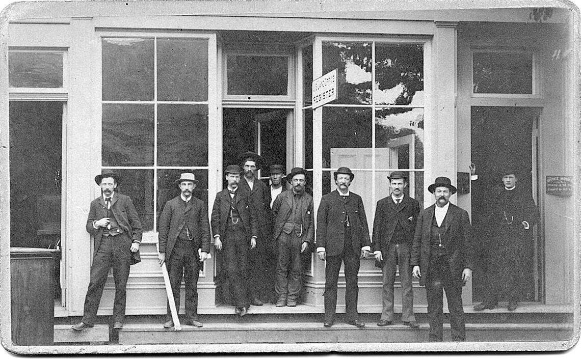 The Homestead Act encouraged American settlers to come to the west and claim land for a small fee. This photograph from the 1880s shows Olympia’s U.S. Land Office, north of Main Street and Sixth Avenue (Capitol Way and Legion), where settlers could file their claims. The man with the furled paper is early settler Charles M. Moore. Image selected and captioned by Deborah Ross on behalf of the Olympia Historical Society and Bigelow House Museum, https://olympiahistory.org.