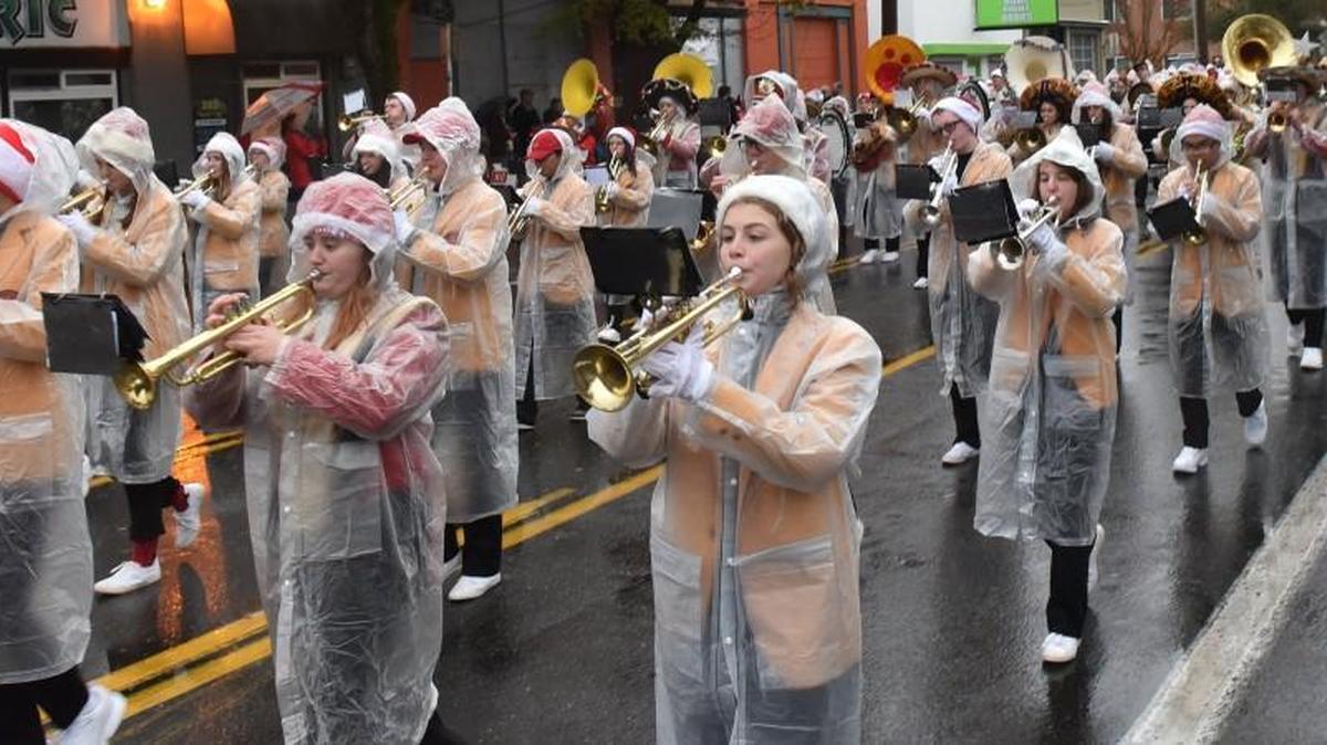The Capital High School Marching Band makes its way down Capitol Way to Sylvester Park during the 2016 Downtown of the Holidays parade in Olympia. Rain is in the forecast for this Sunday’s festivities as well.