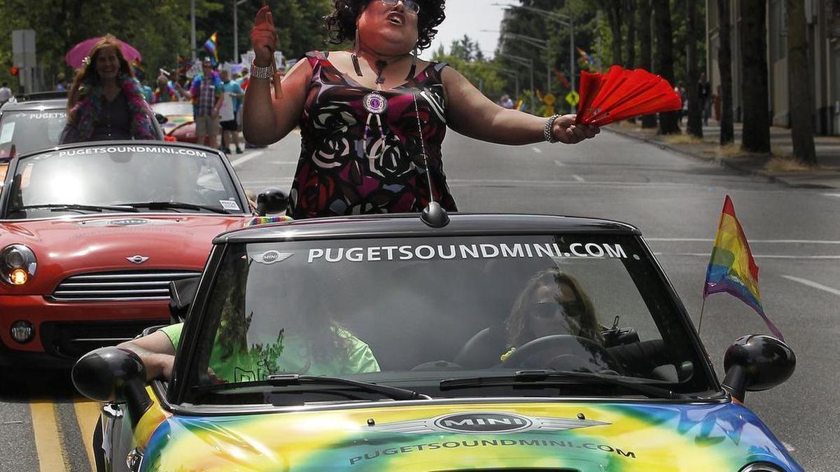 At the 2014 Capital City Pride Parade, Grand Marshal Miss Tina Turntable belts out a song for the crowds along Capitol Way June 22, 2014.