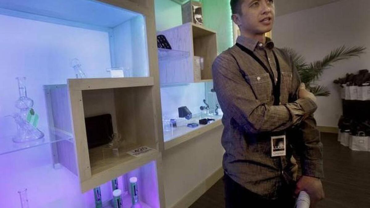 
Christian Pang, co-owner of the Lacey-based pot retailer Lucid, is shown here after the business opened in December. A percentage of his sales have generated enforcement revenue for the city of Lacey.
