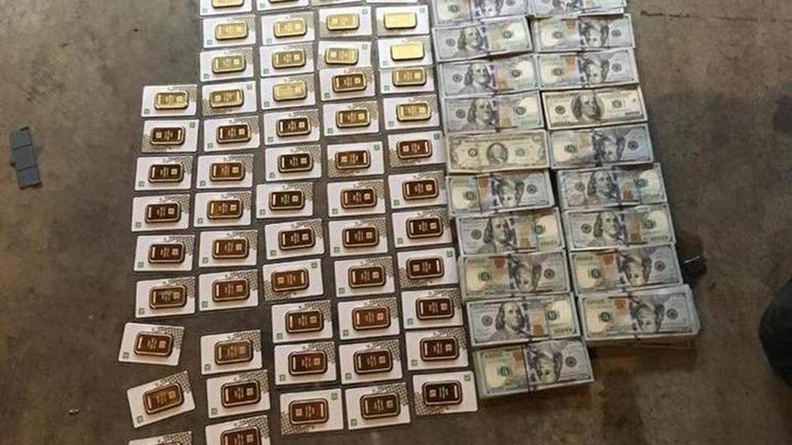Cash and gold seized in Tuesday’s raids.