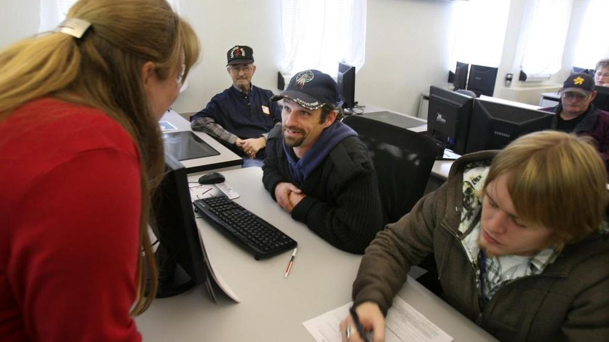 Denise Clark of WorkSource helps veterans prepare resumes for a 2007 job fair in Olympia.