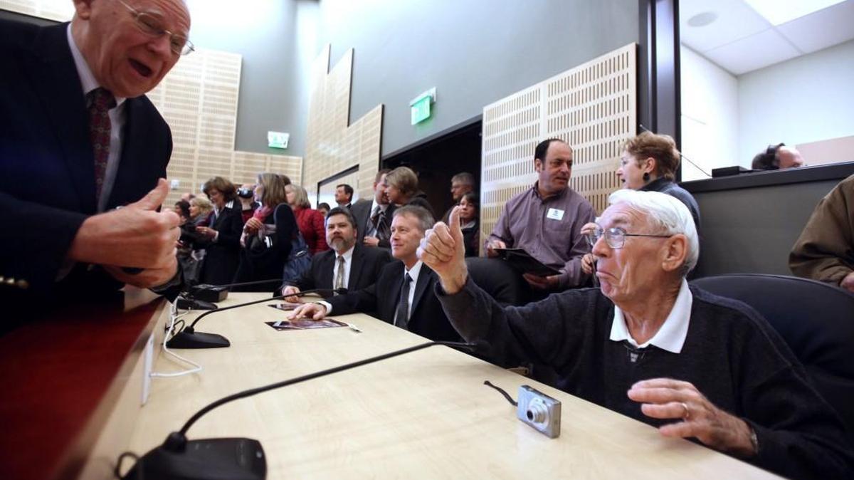 File photo: Eldon Marshall (right), a former Olympia city supervisor who also attended the dedication of the old city hall, gives a thumbs up to Charlie Roe, father of city council member Jeannine Roe, during ceremonies to dedicate the new Olympia City Hall on Saturday, March 26, 2011.