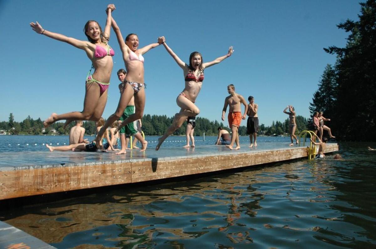 Swimmers strike a midair pose at Long Lake Park in Lacey.