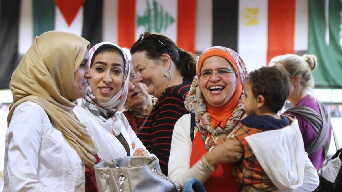 Marwa Shehata (from left), of Olympia, Lama Masri of Seattle and Manal Aal of Olympia gather at the Olympia Center during the Shuruq Olympia Arab Festival on Saturday, Oct. 4, 2014. Shehata and Aal are Egyptian. Masri is from Palestine. A fundraiser for the 2016 event is Saturday.