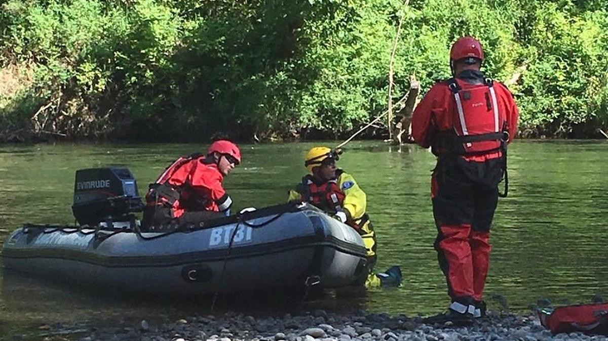 Swiftwater crews during training Saturday along the Nisqually River had to rescue a woman who had been floating through the area when she became trapped beneath a log, according to the Lacey Fire District 3.