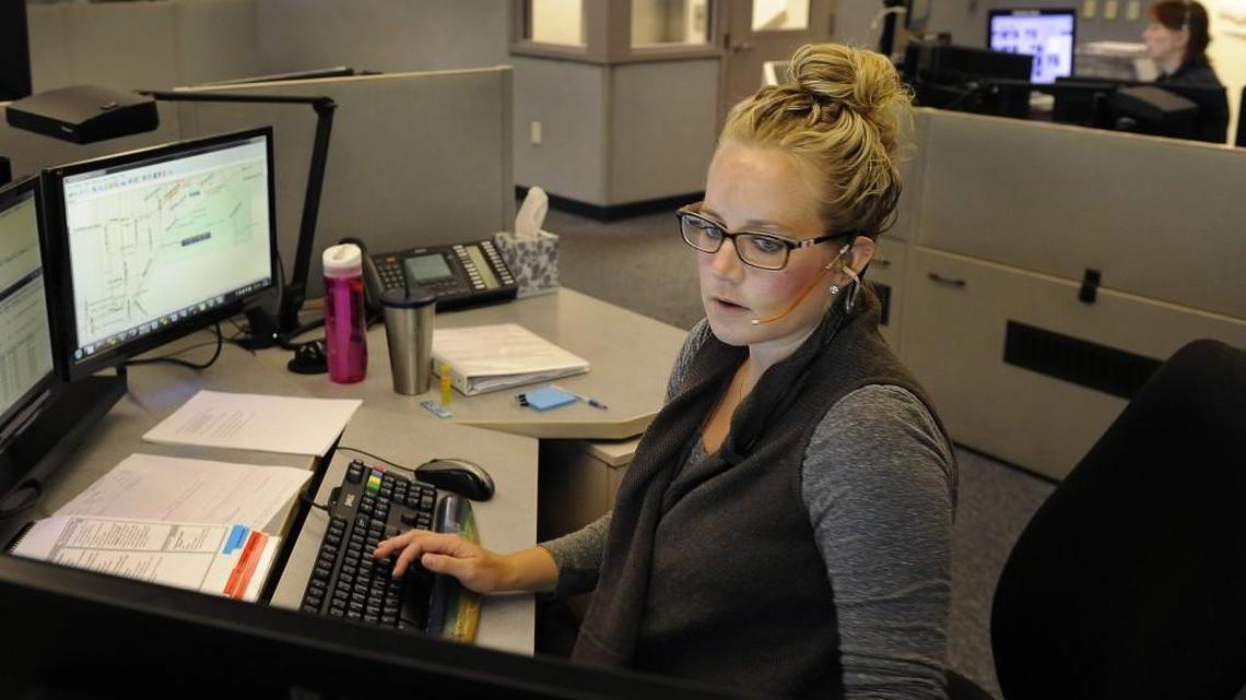 Thurston Communications 911 dispatcher Nichol Eberle is shown here handling emergency calls.