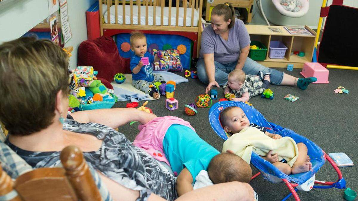 Barb Steele, left, and Tera Herting, lead infant teachers, watch infants play and nap at Promise Day Care near Bellingham in 2018.