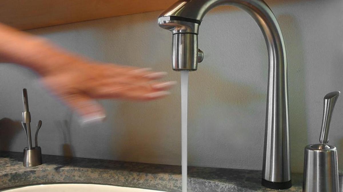 This file photo shows a no-touch automatic kitchen faucet. An increase in water fees in Olympia has been proposed for next year.