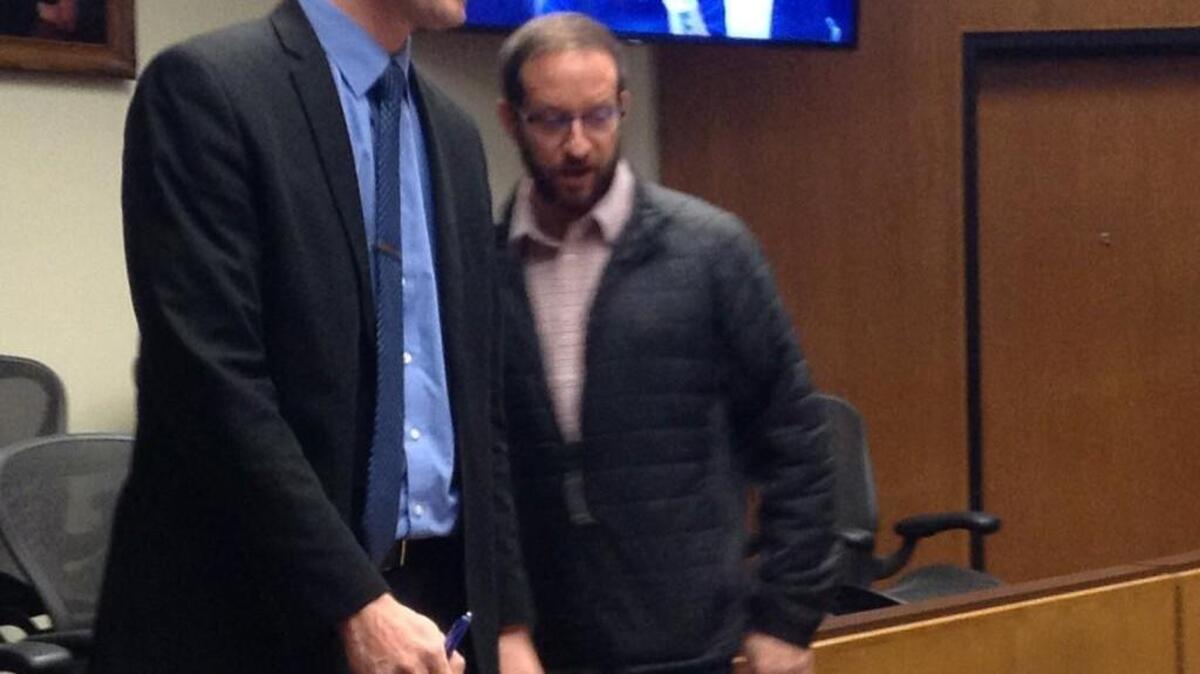 Hunter Scott Christian exits the courtroom Tuesday after he pleaded not guilty to 13 counts of animal abuse.