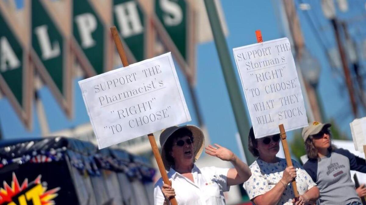 FILE PHOTO: Judy Mallinger and Elaine Degroot stand in front of Ralph's Thriftway in 2006 to protest Ralph’s decision not to stock emergency contraception.